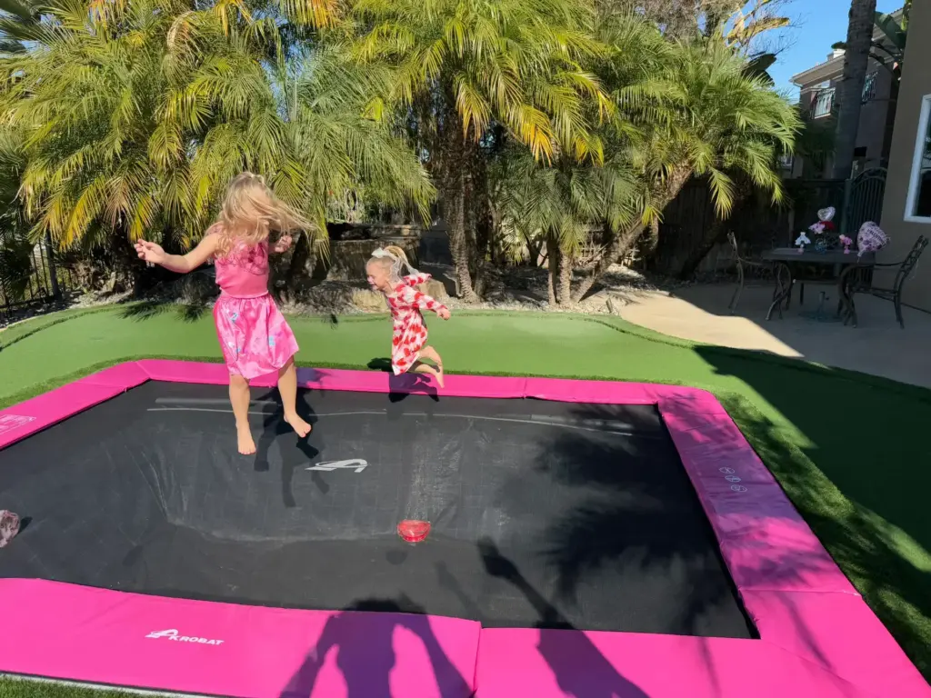 Girl jumping on trampoline